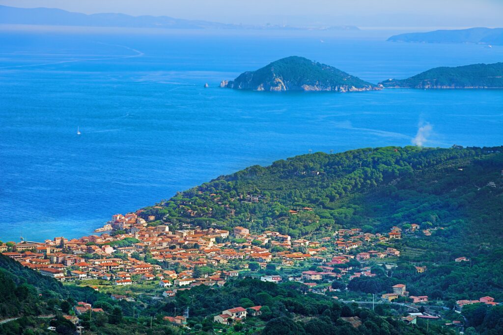 View above Marciana Marina and the Mediterranean Sea at Elba Island, Tuscan Archipelago, Italy.