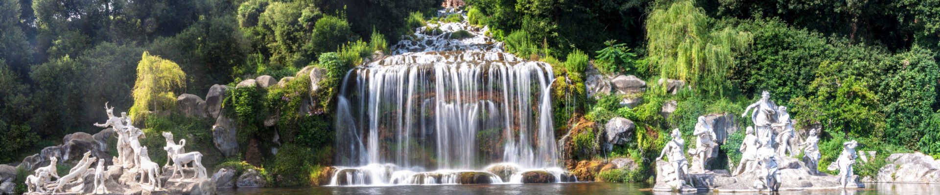 Artificial waterfall and statues at the garden of Palace of Caserta in southern Italy