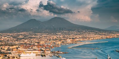 Naples, Italy. Top View Cityscape Skyline Of Naples With Mount Vesuvius And Gulf Of Naples In Background.