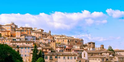 Perugia skyline under azure blue sky.