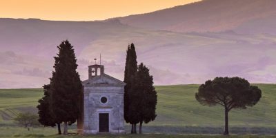 Chapel of Madonna in morning light in the hills of Tuscany, Italy, April.